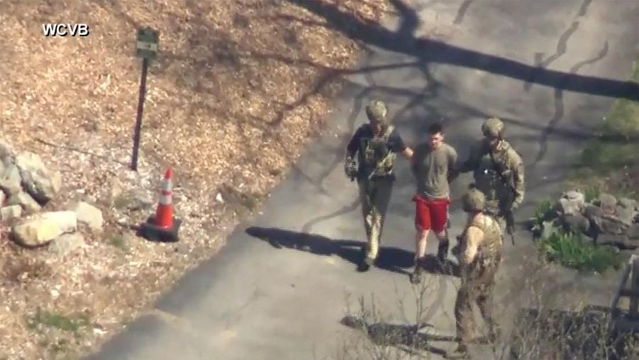 FBI agents arrest Jack Teixeira, an employee of the U.S. Air Force National Guard, in connection with an investigation into the leaks online of classified U.S. documents, outside a residence in this still image taken from video in North Dighton, Massachusetts, U.S., April 13, 2023. WCVB-TV via ABC via REUTERS. ATTENTION EDITORS - NO SALES NO ARCHIVES THIS IMAGE HAS BEEN SUPPLIED BY A THIRD PARTY MANDATORY CREDIT