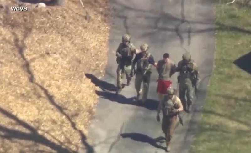 FBI agents arrest Jack Teixeira, an employee of the U.S. Air Force National Guard, in connection with an investigation into the leaks online of classified U.S. documents, outside a residence in this still image taken from video in North Dighton, Massachusetts, U.S., April 13, 2023. WCVB-TV via ABC via REUTERS. ATTENTION EDITORS - NO SALES NO ARCHIVES THIS IMAGE HAS BEEN SUPPLIED BY A THIRD PARTY MANDATORY CREDIT