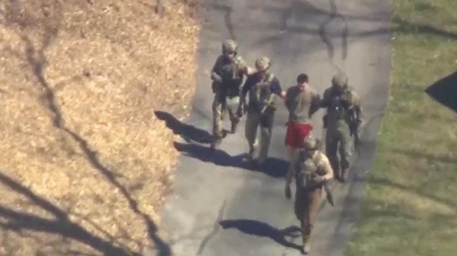 FBI agents arrest Jack Teixeira, an employee of the U.S. Air Force National Guard, in connection with an investigation into the leaks online of classified U.S. documents, outside a residence in this still image taken from video in North Dighton, Massachusetts, U.S., April 13, 2023. WCVB-TV via ABC via REUTERS. ATTENTION EDITORS - NO SALES NO ARCHIVES THIS IMAGE HAS BEEN SUPPLIED BY A THIRD PARTY MANDATORY CREDIT