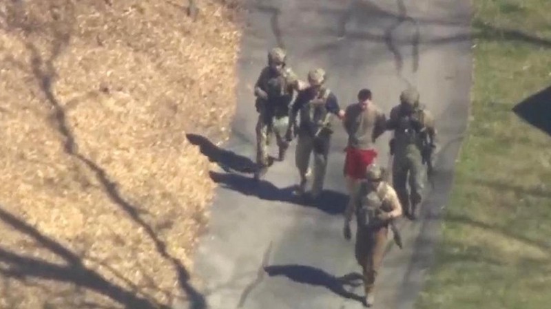 FBI agents arrest Jack Teixeira, an employee of the U.S. Air Force National Guard, in connection with an investigation into the leaks online of classified U.S. documents, outside a residence in this still image taken from video in North Dighton, Massachusetts, U.S., April 13, 2023. WCVB-TV via ABC via REUTERS. ATTENTION EDITORS - NO SALES NO ARCHIVES THIS IMAGE HAS BEEN SUPPLIED BY A THIRD PARTY MANDATORY CREDIT