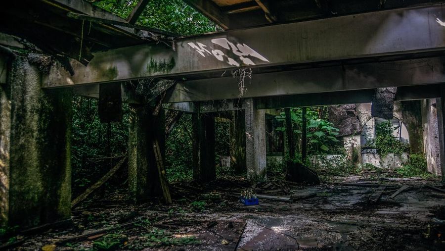 A motel is pictures inside the Mimaland theme park after 24 year close July 19, 2017 in Kuala Lumpur, Malaysia. Mimaland started operating in 1971, it was built on a hilly area of 300 acres in Ulu Gombak near Kuala Lumpur, first phase was completed in 1970, and consisted of 24 motels, 5 chalets and a swimming pool. The main attractions, was the 'prehistoric animal park' containing dinosaur.In January 1993, a 27-year-old Singaporean was killed while using the giant slide at the Mimaland pool. The incident shocked the public and resulted in a temporary closure of Mimaland. a minor landslide caused damage to the walls of the same pool in May 1994. This incident caused muddy water to seep into the pool, causing the area to close to the public, Mimaland was closed permanently in 1994. Photo by Samsul Said (Photo by Samsul Said/NurPhoto via Getty Images)