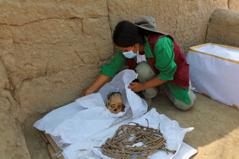 Archaeologists work at the archaeological complex of Cajamarquilla where pre-Inca mummies from 900 to 1200 years old were discovered,  in Lima, Peru April 24, 2023. REUTERS/Sebastian Castaneda