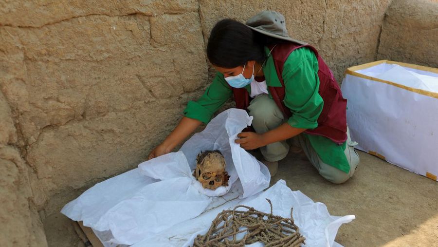 Archaeologists work at the archaeological complex of Cajamarquilla where pre-Inca mummies from 900 to 1200 years old were discovered,  in Lima, Peru April 24, 2023. REUTERS/Sebastian Castaneda