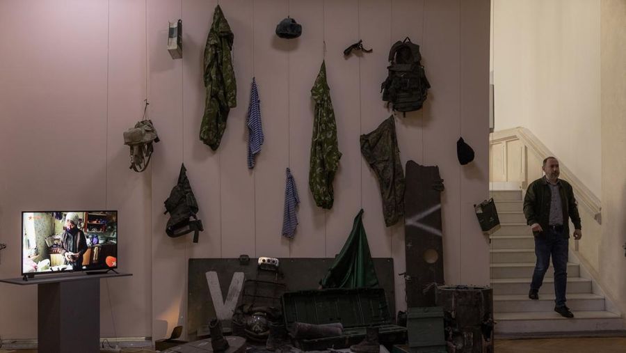 KYIV, UKRAINE - APRIL 26: A man walks down the steps next to exhibited items of the Russian army on April 26, 2023 at the National Museum of the History of Ukraine in Kyiv, Ukraine. Museum curators retrieved a variety of items left by Russian soldiers during the first part of their 2022 invasion, when Russian forces occupied areas around Kyiv. Russia ultimately retreated from around the capital, concentrating its land war in the east. (Photo by Roman Pilipey/Getty Images)