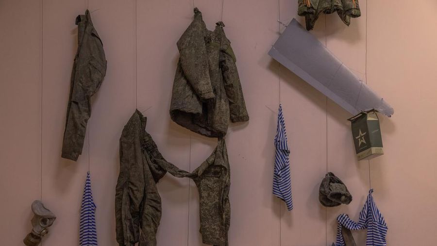 KYIV, UKRAINE - APRIL 26: A man walks down the steps next to exhibited items of the Russian army on April 26, 2023 at the National Museum of the History of Ukraine in Kyiv, Ukraine. Museum curators retrieved a variety of items left by Russian soldiers during the first part of their 2022 invasion, when Russian forces occupied areas around Kyiv. Russia ultimately retreated from around the capital, concentrating its land war in the east. (Photo by Roman Pilipey/Getty Images)