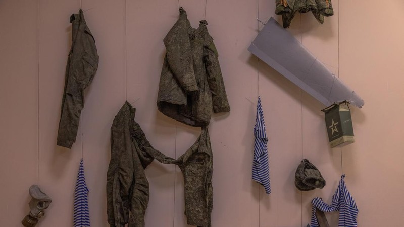 KYIV, UKRAINE - APRIL 26: A man walks down the steps next to exhibited items of the Russian army on April 26, 2023 at the National Museum of the History of Ukraine in Kyiv, Ukraine. Museum curators retrieved a variety of items left by Russian soldiers during the first part of their 2022 invasion, when Russian forces occupied areas around Kyiv. Russia ultimately retreated from around the capital, concentrating its land war in the east. (Photo by Roman Pilipey/Getty Images)