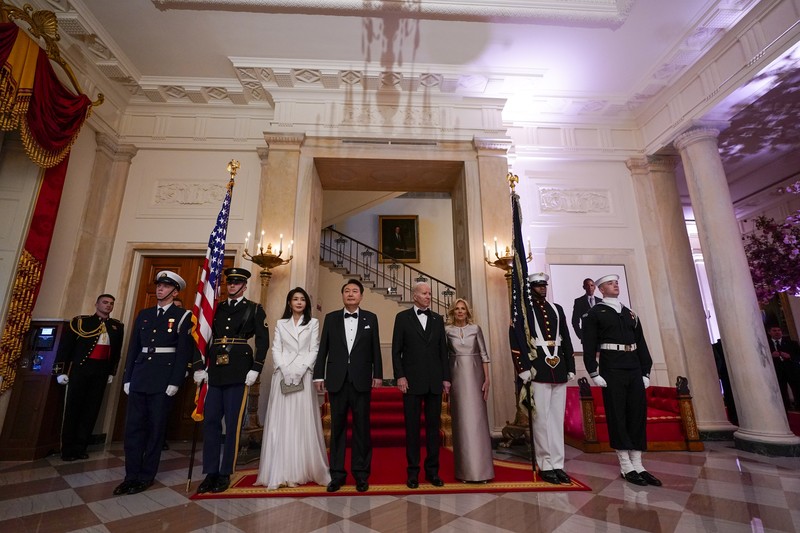 Biden US South Korea South Korea's President Yoon Suk Yeol and his wife Kim Keon Hee and President Joe Biden and first lady Jill Biden arrive for a photo in front of the Grand Staircase during a State Dinner at the White House in Washington, Wednesday, April 26, 2023. (AP Photo/Susan Walsh)
