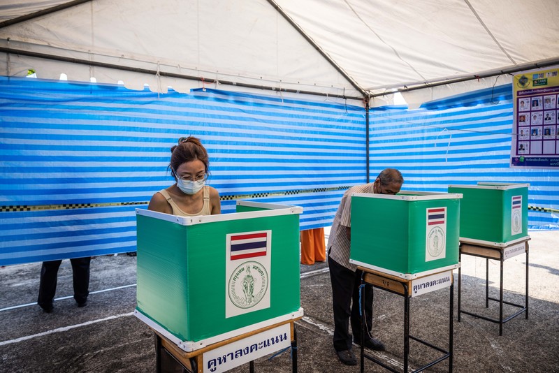 1254695302 Voters cast their ballots in the Khan Na Yao area in Bangkok, Thailand, on Sunday, May 14, 2023. A record number of Thais are projected to go to the ballot boxes in Sunday's parliamentary election as voters decide if they'll shift leadership away from almost a decade of military-backed rule. More than 50 million Thais are eligible to vote, and the Election Commission expects an 80% turnout. Photographer: Andre Malerba/Bloomberg via Getty Images