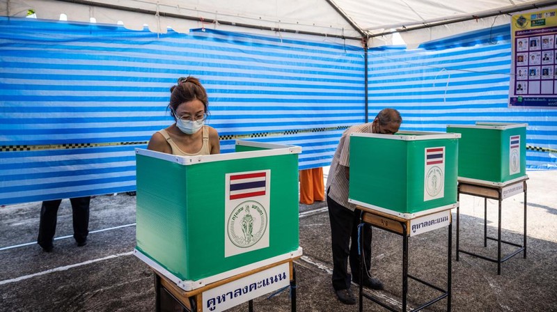 Voters cast their ballots in the Khan Na Yao area in Bangkok, Thailand, on Sunday, May 14, 2023. A record number of Thais are projected to go to the ballot boxes in Sunday's parliamentary election as voters decide if they'll shift leadership away from almost a decade of military-backed rule. More than 50 million Thais are eligible to vote, and the Election Commission expects an 80% turnout. Photographer: Andre Malerba/Bloomberg via Getty Images