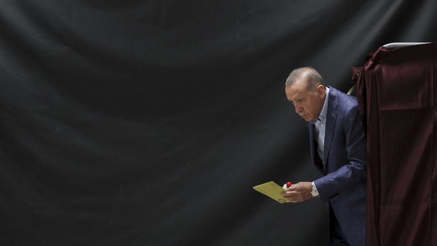 ISTANBUL, TURKEY - MAY 14: Turkish President Recep Tayyip Erdogan walks out of a voting booth at a polling station in the Uskudar district as he casts his vote in Turkey's general elections on May 14, 2023 in Istanbul, Turkey. Today, President Recep Tayyip Erdogan faces his biggest electoral test as the country goes to the polls in the country's general election. Erdogan has been in power for more than two decades -- first as prime minister, then as president -- but his popularity has recently taken a hit due to Turkey's ongoing economic crisis and his government's response to a series of devastating earthquakes. Meanwhile, the political opposition has united around one candidate, Kemal Kilicdaroglu, with some pre-election polls giving him an edge. (Photo by Umit Bektas-Pool/Getty Images)