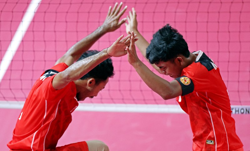 Malaysia's Muhammad Hafizul Hayazi Adnan (C-L) and Indonesia's Muhammad Hardiansyah (C) compete in their men's double sepak takraw final event during the 32nd Southeast Asian Games (SEA Games) in Phnom Penh on May 15, 2023. (Photo by MOHD RASFAN / AFP) (Photo by MOHD RASFAN/AFP via Getty Images)