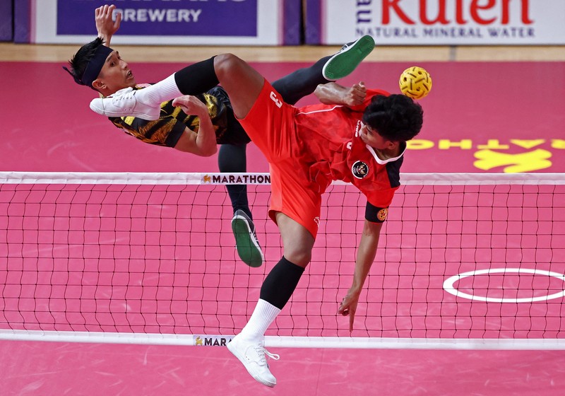 Malaysia's Muhammad Hafizul Hayazi Adnan (C-L) and Indonesia's Muhammad Hardiansyah (C) compete in their men's double sepak takraw final event during the 32nd Southeast Asian Games (SEA Games) in Phnom Penh on May 15, 2023. (Photo by MOHD RASFAN / AFP) (Photo by MOHD RASFAN/AFP via Getty Images)