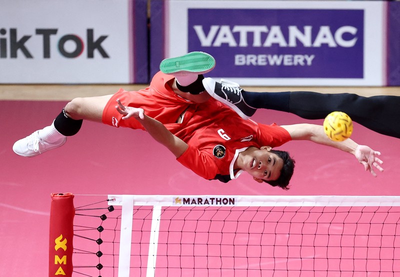 Malaysia's Muhammad Hafizul Hayazi Adnan (C-L) and Indonesia's Muhammad Hardiansyah (C) compete in their men's double sepak takraw final event during the 32nd Southeast Asian Games (SEA Games) in Phnom Penh on May 15, 2023. (Photo by MOHD RASFAN / AFP) (Photo by MOHD RASFAN/AFP via Getty Images)