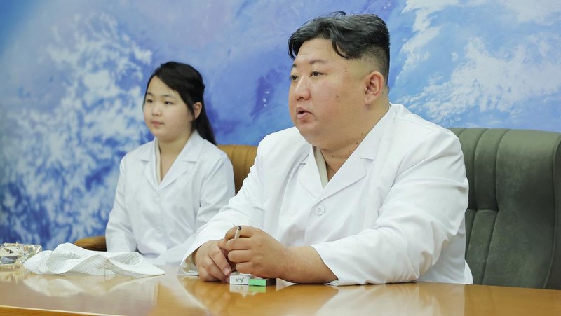 North Korean leader Kim Jong Un and his daughter Kim Ju Ae meet with members of the Non-permanent Satellite Launch Preparatory Committee, as he inspects the country's first military reconnaissance satellite, in Pyongyang, North Korea May 16, 2023, in this image released by North Korea's Korean Central News Agency on May 17, 2023. KCNA via REUTERS ATTENTION EDITORS - THIS IMAGE WAS PROVIDED BY A THIRD PARTY. REUTERS IS UNABLE TO INDEPENDENTLY VERIFY THIS IMAGE. NO THIRD PARTY SALES. SOUTH KOREA OUT. NO COMMERCIAL OR EDITORIAL SALES IN SOUTH KOREA. IMAGE HAS BEEN DIGITALLY OBSCURED AT SOURCE