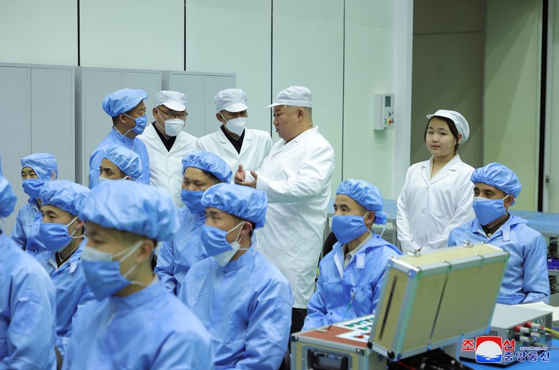 NORTHKOREA-MILITARY/ North Korean leader Kim Jong Un and his daughter Kim Ju Ae meet with members of the Non-permanent Satellite Launch Preparatory Committee, as he inspects the country's first military reconnaissance satellite, in Pyongyang, North Korea May 16, 2023, in this image released by North Korea's Korean Central News Agency on May 17, 2023. KCNA via REUTERS ATTENTION EDITORS - THIS IMAGE WAS PROVIDED BY A THIRD PARTY. REUTERS IS UNABLE TO INDEPENDENTLY VERIFY THIS IMAGE. NO THIRD PARTY SALES. SOUTH KOREA OUT. NO COMMERCIAL OR EDITORIAL SALES IN SOUTH KOREA. IMAGE HAS BEEN DIGITALLY OBSCURED AT SOURCE
