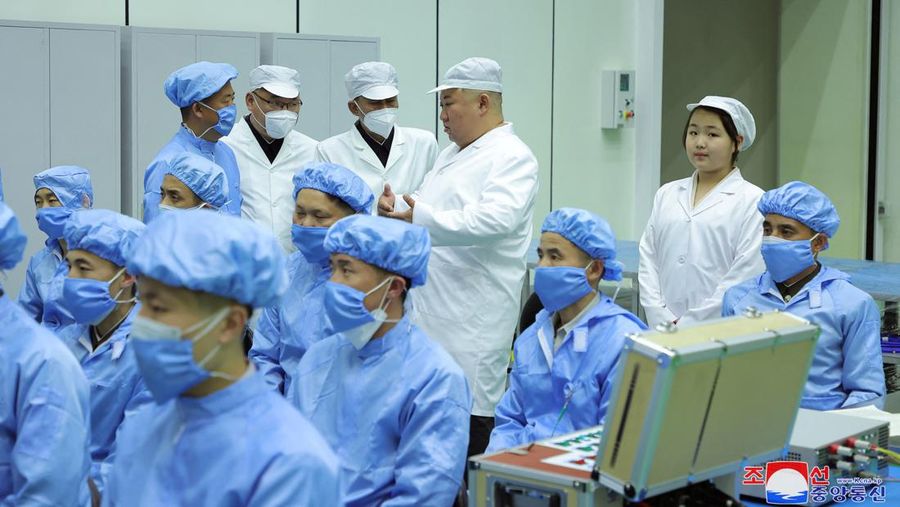 North Korean leader Kim Jong Un and his daughter Kim Ju Ae meet with members of the Non-permanent Satellite Launch Preparatory Committee, as he inspects the country's first military reconnaissance satellite, in Pyongyang, North Korea May 16, 2023, in this image released by North Korea's Korean Central News Agency on May 17, 2023. KCNA via REUTERS ATTENTION EDITORS - THIS IMAGE WAS PROVIDED BY A THIRD PARTY. REUTERS IS UNABLE TO INDEPENDENTLY VERIFY THIS IMAGE. NO THIRD PARTY SALES. SOUTH KOREA OUT. NO COMMERCIAL OR EDITORIAL SALES IN SOUTH KOREA. IMAGE HAS BEEN DIGITALLY OBSCURED AT SOURCE