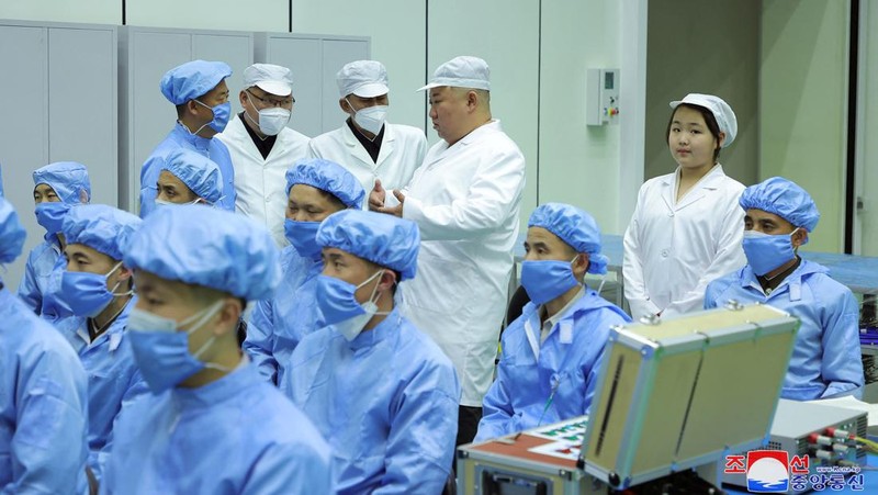 North Korean leader Kim Jong Un and his daughter Kim Ju Ae meet with members of the Non-permanent Satellite Launch Preparatory Committee, as he inspects the country's first military reconnaissance satellite, in Pyongyang, North Korea May 16, 2023, in this image released by North Korea's Korean Central News Agency on May 17, 2023. KCNA via REUTERS ATTENTION EDITORS - THIS IMAGE WAS PROVIDED BY A THIRD PARTY. REUTERS IS UNABLE TO INDEPENDENTLY VERIFY THIS IMAGE. NO THIRD PARTY SALES. SOUTH KOREA OUT. NO COMMERCIAL OR EDITORIAL SALES IN SOUTH KOREA. IMAGE HAS BEEN DIGITALLY OBSCURED AT SOURCE