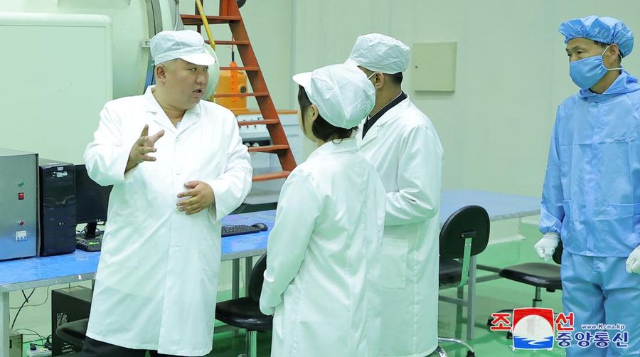 North Korean leader Kim Jong Un and his daughter Kim Ju Ae meet with members of the Non-permanent Satellite Launch Preparatory Committee, as he inspects the country's first military reconnaissance satellite, in Pyongyang, North Korea May 16, 2023, in this image released by North Korea's Korean Central News Agency on May 17, 2023. KCNA via REUTERS ATTENTION EDITORS - THIS IMAGE WAS PROVIDED BY A THIRD PARTY. REUTERS IS UNABLE TO INDEPENDENTLY VERIFY THIS IMAGE. NO THIRD PARTY SALES. SOUTH KOREA OUT. NO COMMERCIAL OR EDITORIAL SALES IN SOUTH KOREA. IMAGE HAS BEEN DIGITALLY OBSCURED AT SOURCE