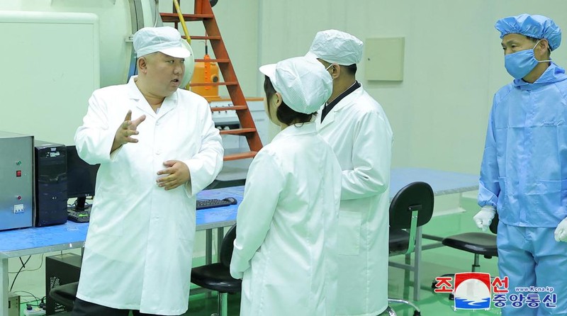 North Korean leader Kim Jong Un and his daughter Kim Ju Ae meet with members of the Non-permanent Satellite Launch Preparatory Committee, as he inspects the country's first military reconnaissance satellite, in Pyongyang, North Korea May 16, 2023, in this image released by North Korea's Korean Central News Agency on May 17, 2023. KCNA via REUTERS ATTENTION EDITORS - THIS IMAGE WAS PROVIDED BY A THIRD PARTY. REUTERS IS UNABLE TO INDEPENDENTLY VERIFY THIS IMAGE. NO THIRD PARTY SALES. SOUTH KOREA OUT. NO COMMERCIAL OR EDITORIAL SALES IN SOUTH KOREA. IMAGE HAS BEEN DIGITALLY OBSCURED AT SOURCE