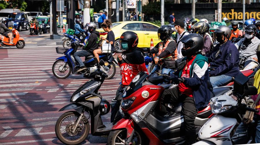 Motorists at a traffic signal in Bangkok, Thailand, on Thursday, May 18, 2023. The emerging El Nino is already contributing to severe heat that's roasted Southeast Asia in recent weeks. The weather pattern typically results in hotter, drier conditions in many parts of Asia. Photographer: Andre Malerba/Bloomberg via Getty Images