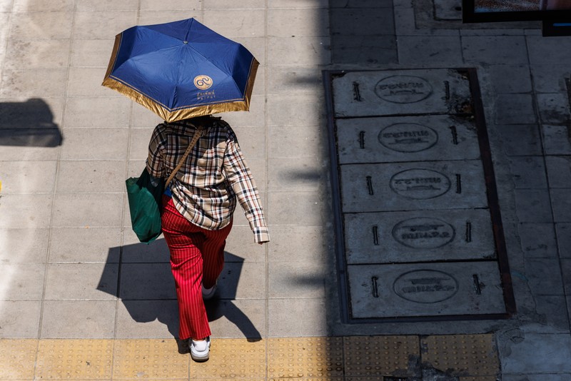 1255977151 A man sleeps at a park in Bangkok, Thailand, on Thursday, May 18, 2023. The emerging El Nino is already contributing to severe heat that's roasted Southeast Asia in recent weeks. The weather pattern typically results in hotter, drier conditions in many parts of Asia. Photographer: Andre Malerba/Bloomberg via Getty Images