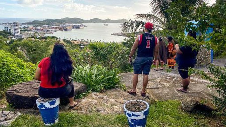 People look out toward the seafront from the Vierge du Pacifique in Noumea on May 19, 2023, after an earthquake hit the island. A tsunami warning in the Pacific has been lifted after a 7.7-magnitude earthquake struck on May 19, sent many islanders in the region fleeing the coast. (Photo by Mathurin DEREL / AFP)