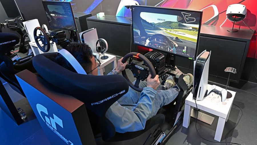 SHANGHAI, CHINA - MAY 24, 2023 - People play a PlayStation racing game at the Sony Expo 2023 in Shanghai, China, May 24, 2023. (Photo by Costfoto/NurPhoto via Getty Images)