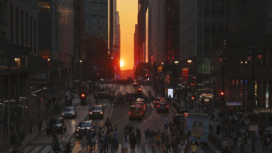 NEW YORK, NY - MAY 29:  The sun sets along 42nd Street during a  Manhattanhenge sunset on May 29, 2023, in New York City.  (Photo by Gary Hershorn/Getty Images)