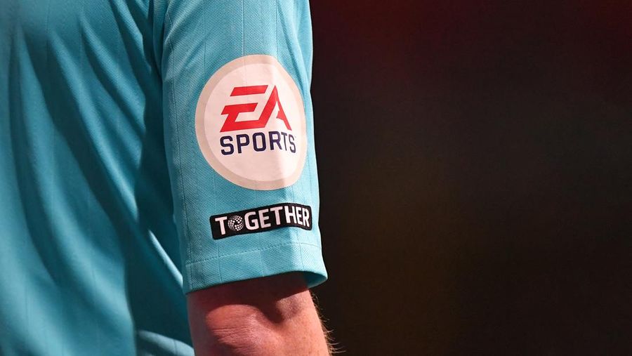 BOLTON, ENGLAND - JANUARY 10: A general view of the EA Sports and Together badges on the assistant referees arm during the Papa John's Trophy Quarter Final match between Bolton Wanderers and Portsmouth at University of Bolton Stadium on January 10, 2