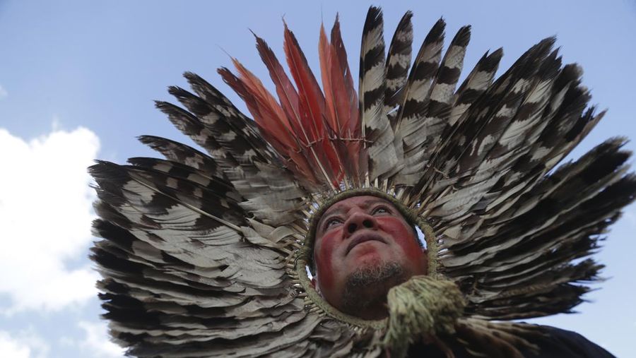 Guarani Indigenous block the Bandeirantes highway with burning tires to protest proposed legislation that would change the policy that demarcates Indigenous lands on the outskirts of Sao Paulo, Brazil, Tuesday, May 30, 2023. (AP Photo/Ettore Chiereguini)