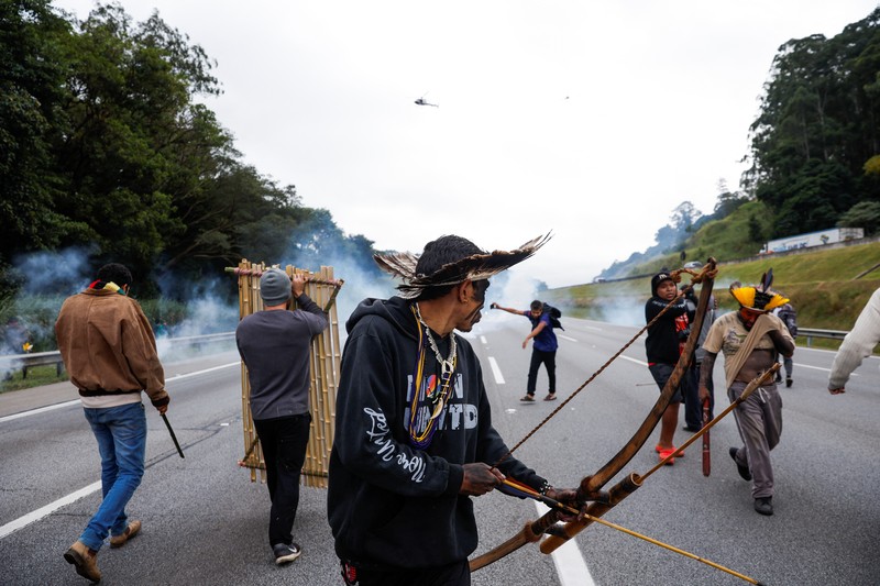 Brazil Indigenous Protest Guarani Indigenous block the Bandeirantes highway with burning tires to protest proposed legislation that would change the policy that demarcates Indigenous lands on the outskirts of Sao Paulo, Brazil, Tuesday, May 30, 2023. (AP Photo/Ettore Chiereguini)
