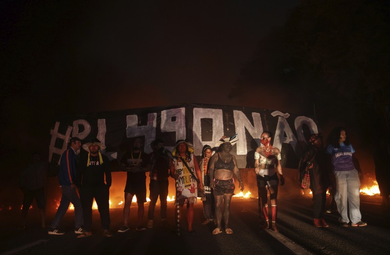 Brazil Indigenous Protest Guarani Indigenous block the Bandeirantes highway with burning tires to protest proposed legislation that would change the policy that demarcates Indigenous lands on the outskirts of Sao Paulo, Brazil, Tuesday, May 30, 2023. (AP Photo/Ettore Chiereguini)