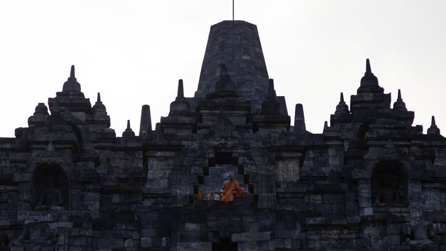 Buddhist monks descended from the Borobudur temple after performing Pradaksina at Borobudur temple in Magelang, Central Java, on June 1, 2023. 32 buddhist monks from Thailand, Malaysia and Indonesia who made a religious journey of more than 2,000 Km (International Thuddong), from Thailand to Indonesia, finished their journey at Borobudur Temple, to further celebrate Vesak Day on June 4. (Photo by Aditya Irawan/NurPhoto via Getty Images)