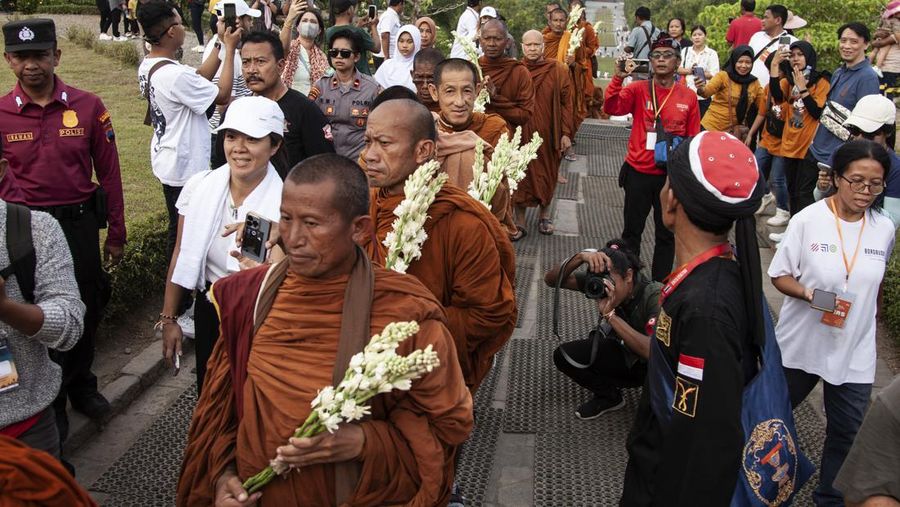 Buddhist Monks from are arrive at Borobudur temple in Magelang, Central Java, on June 1, 2023. 32 buddhist monks from Thailand, Malaysia and Indonesia who made a religious journey of more than 2,000 Km (International Thuddong), from Thailand to Indonesia, finished their journey at Borobudur Temple, to further celebrate Vesak Day on June 4. (Photo by Aditya Irawan/NurPhoto via Getty Images)