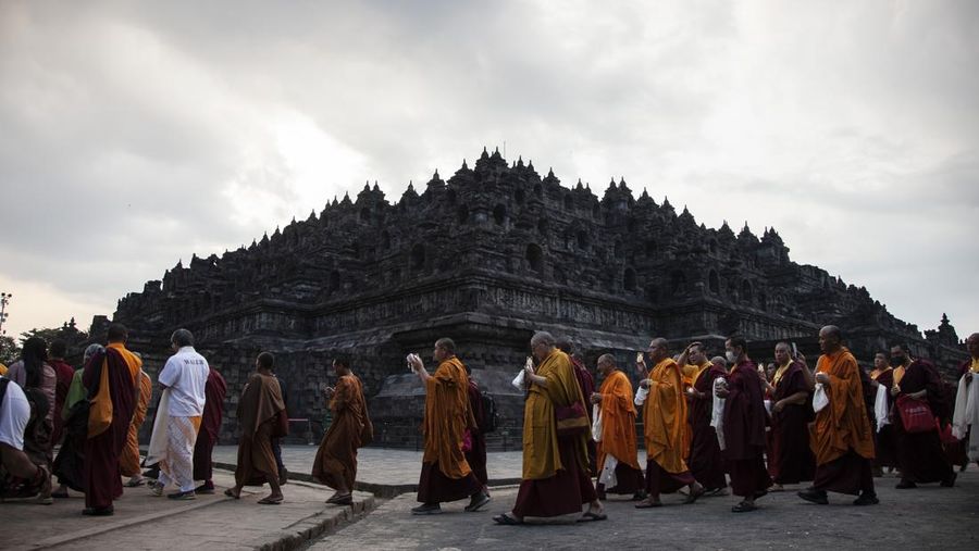 Buddhist Monks from are arrive at Borobudur temple in Magelang, Central Java, on June 1, 2023. 32 buddhist monks from Thailand, Malaysia and Indonesia who made a religious journey of more than 2,000 Km (International Thuddong), from Thailand to Indonesia, finished their journey at Borobudur Temple, to further celebrate Vesak Day on June 4. (Photo by Aditya Irawan/NurPhoto via Getty Images)