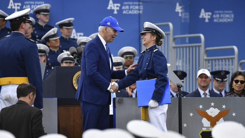 A cadet receives her diploma and shakes hands with President Joe Biden during the United States Air Force Academy graduation ceremony, Thursday, June 1, 2023, at Air force Academy, Colo. (AP Photo/John Leyba)