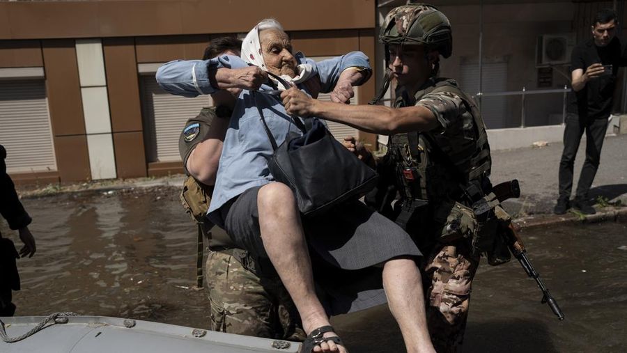 Streets are flooded in Kherson, Ukraine, Wednesday, June 7, 2023 after the Kakhovka dam was blown up. Residents of southern Ukraine, some who spent the night on rooftops, braced for a second day of swelling floodwaters on Wednesday as authorities warned that a Dnieper River dam breach would continue to unleash pent-up waters from a giant reservoir. (AP Photo/Libkos)