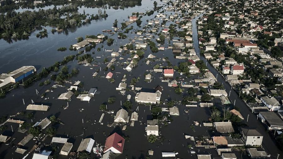 Streets are flooded in Kherson, Ukraine, Wednesday, June 7, 2023 after the Kakhovka dam was blown up. Residents of southern Ukraine, some who spent the night on rooftops, braced for a second day of swelling floodwaters on Wednesday as authorities warned that a Dnieper River dam breach would continue to unleash pent-up waters from a giant reservoir. (AP Photo/Libkos)