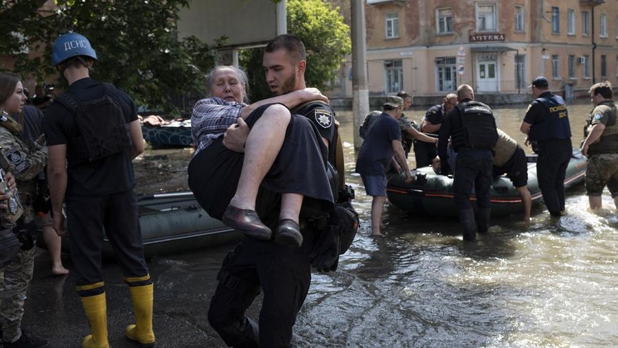 Streets are flooded in Kherson, Ukraine, Wednesday, June 7, 2023 after the Kakhovka dam was blown up. Residents of southern Ukraine, some who spent the night on rooftops, braced for a second day of swelling floodwaters on Wednesday as authorities warned that a Dnieper River dam breach would continue to unleash pent-up waters from a giant reservoir. (AP Photo/Libkos)
