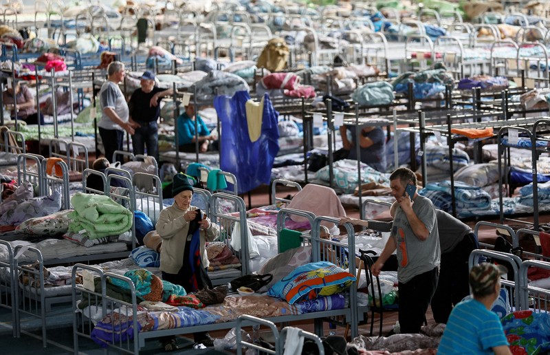 Russia Ukraine War Streets are flooded in Kherson, Ukraine, Wednesday, June 7, 2023 after the Kakhovka dam was blown up. Residents of southern Ukraine, some who spent the night on rooftops, braced for a second day of swelling floodwaters on Wednesday as authorities warned that a Dnieper River dam breach would continue to unleash pent-up waters from a giant reservoir. (AP Photo/Libkos)