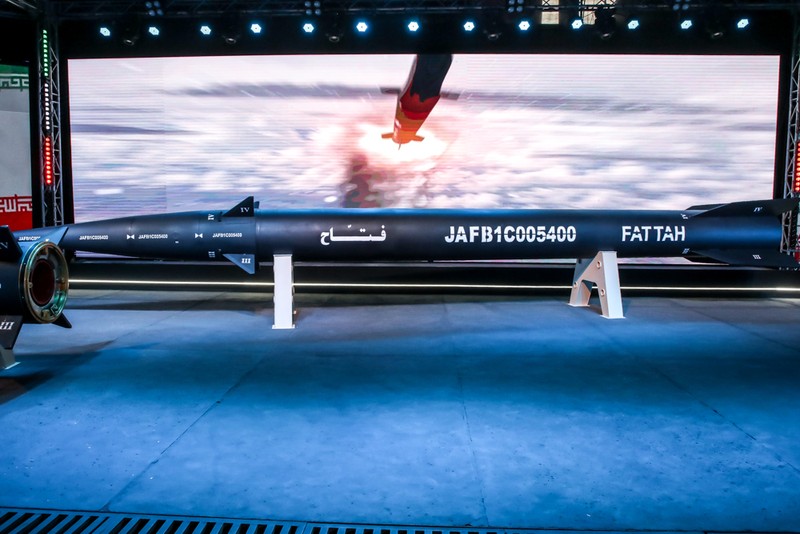 1258527747 An Iranian couple walk past a giant image of Fattah, Iran's first-ever hypersonic missile, in Palestine square in downtown Tehran, June 7, 2023. According to Iran's state media, the Fattah solid fuel hypersonic missile can reach Tel Aviv in 400 seconds from inside Iran and travels at a speed of 5,145 meters per second. (Photo by Morteza Nikoubazl/NurPhoto via Getty Images)