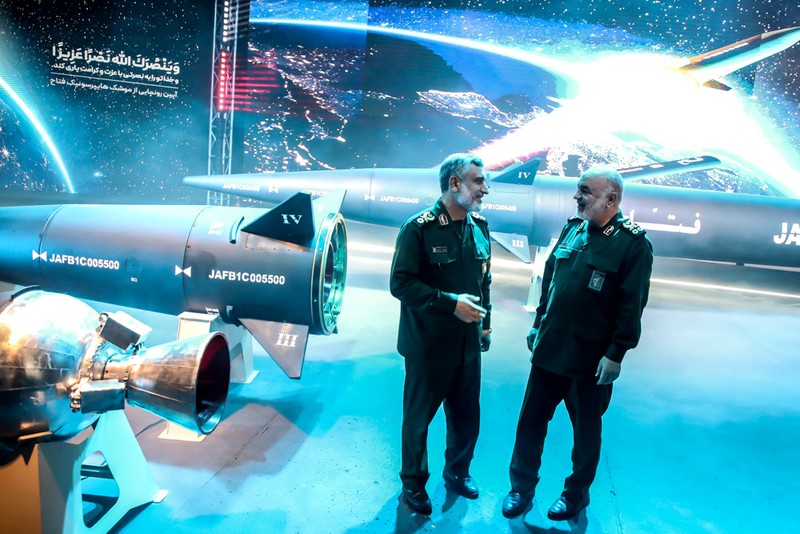 1258527747 An Iranian couple walk past a giant image of Fattah, Iran's first-ever hypersonic missile, in Palestine square in downtown Tehran, June 7, 2023. According to Iran's state media, the Fattah solid fuel hypersonic missile can reach Tel Aviv in 400 seconds from inside Iran and travels at a speed of 5,145 meters per second. (Photo by Morteza Nikoubazl/NurPhoto via Getty Images)