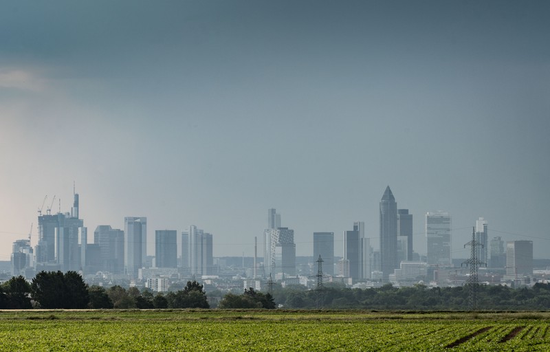 1258532669 08 June 2023, Hesse, Frankfurt/Main: A thunderstorm passes over Frankfurt's bank towers in the morning, while on the left there are already signs of better weather. Photo: Frank Rumpenhorst/dpa (Photo by Frank Rumpenhorst/picture alliance via Getty Images)