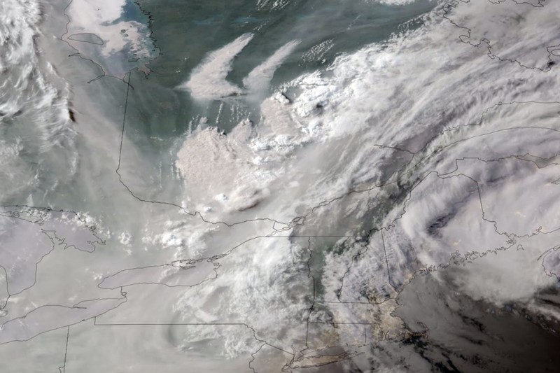Canada Wildfires In this GOES-16 GeoColor satellite image taken Monday, June 5, 2023 at 7 p.m. EDT and provided by CIRA/NOAA, smoke from wildfires burning in Quebec, Canada, top center, drifts southward. (CIRA/NOAA via AP)