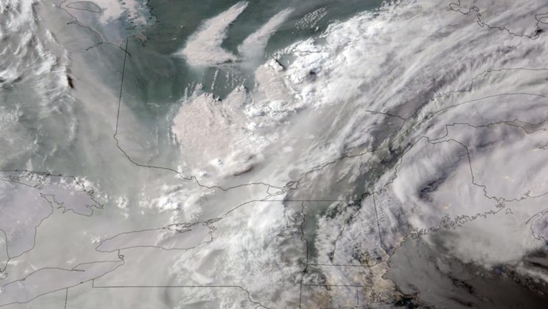 In this GOES-16 GeoColor satellite image taken Monday, June 5, 2023 at 7 p.m. EDT and provided by CIRA/NOAA, smoke from wildfires burning in Quebec, Canada, top center, drifts southward. (CIRA/NOAA via AP)