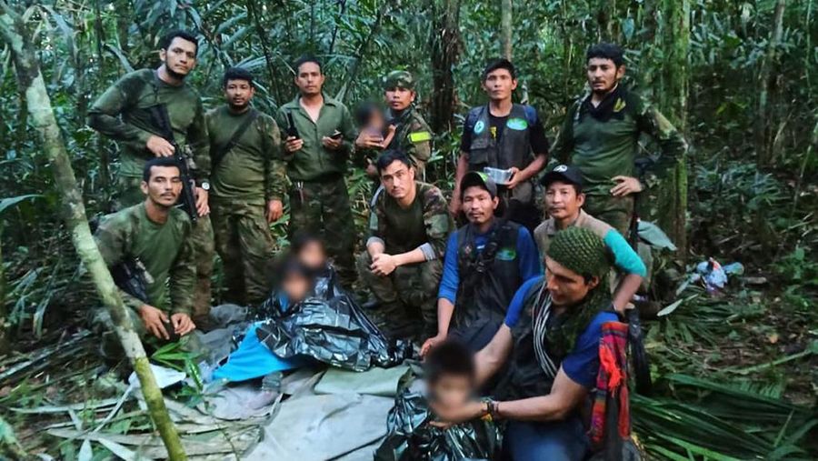 Colombian military soldiers pose for a photo after the rescue of child survivors from a Cessna 206 plane that crashed on May 1 in the jungles of Caqueta, in limits between Caqueta and Guaviare, in this handout photo released June 9, 2023. Presidency/Handout via REUTERS ATTENTION EDITORS - THIS IMAGE WAS PROVIDED BY A THIRD PARTY. MANDATORY CREDIT. NO RESALES. NO ARCHIVES. FACES OF CHILDREN BLURRED AT SOURCE.
