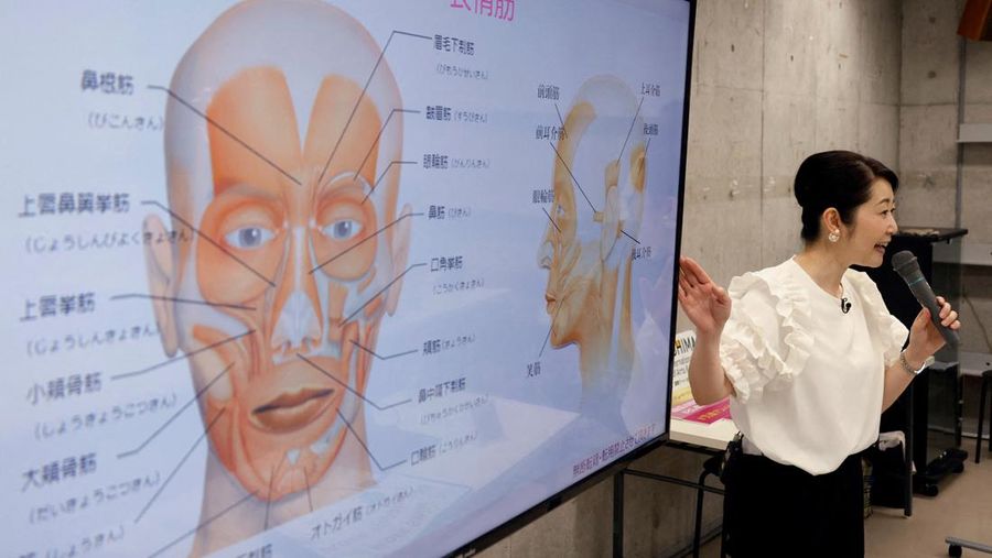 Students practice smiling at a smile training course at Sokei Art School in Tokyo, Japan, May 30, 2023. REUTERS/Kim Kyung-Hoon