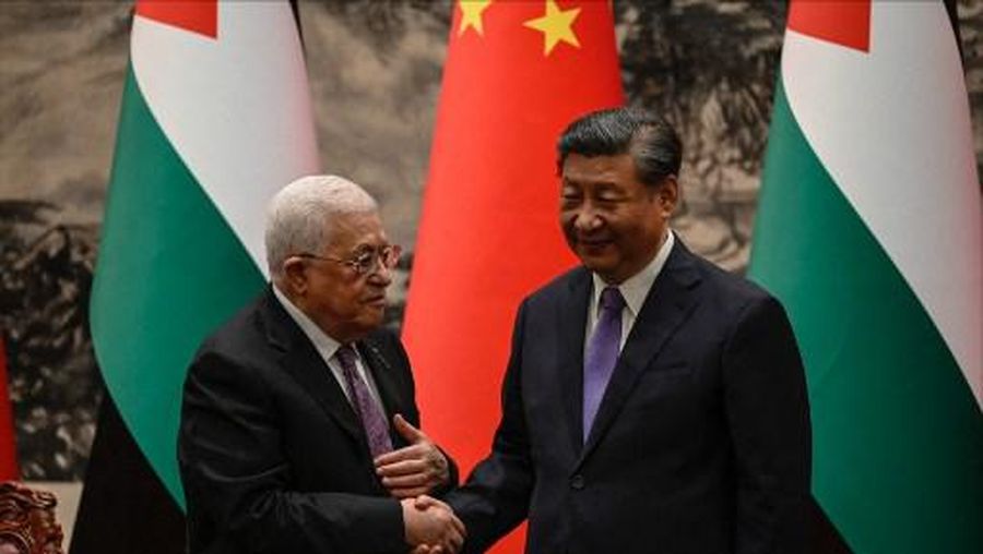 Palestinian President Mahmud Abbas shakes hands with Chinas President Xi Jinping after a signing ceremony at the Great Hall of the People in Beijing on June 14, 2023. (Photo by Jade GAO / POOL / AFP)