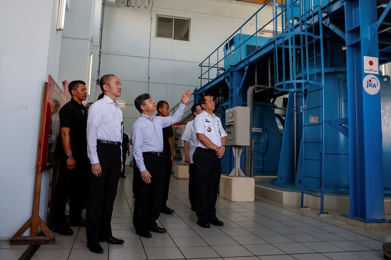 Japan's Emperor Naruhito looks at a water pumping facility that was supported by the Japanese government as he is accompanied by Japan International Cooperation Agency (JICA) expert on integrated water resources management Kikuta Tomoya during a visit at Pluit water pump station in Jakarta, Indonesia, 18 June 2023.   MAST IRHAM/Pool via REUTERS