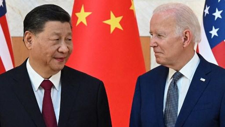 US President Joe Biden (R) and China's President Xi Jinping (L) meet on the sidelines of the G20 Summit in Nusa Dua on the Indonesian resort island of Bali on November 14, 2022. (Photo by SAUL LOEB / AFP)